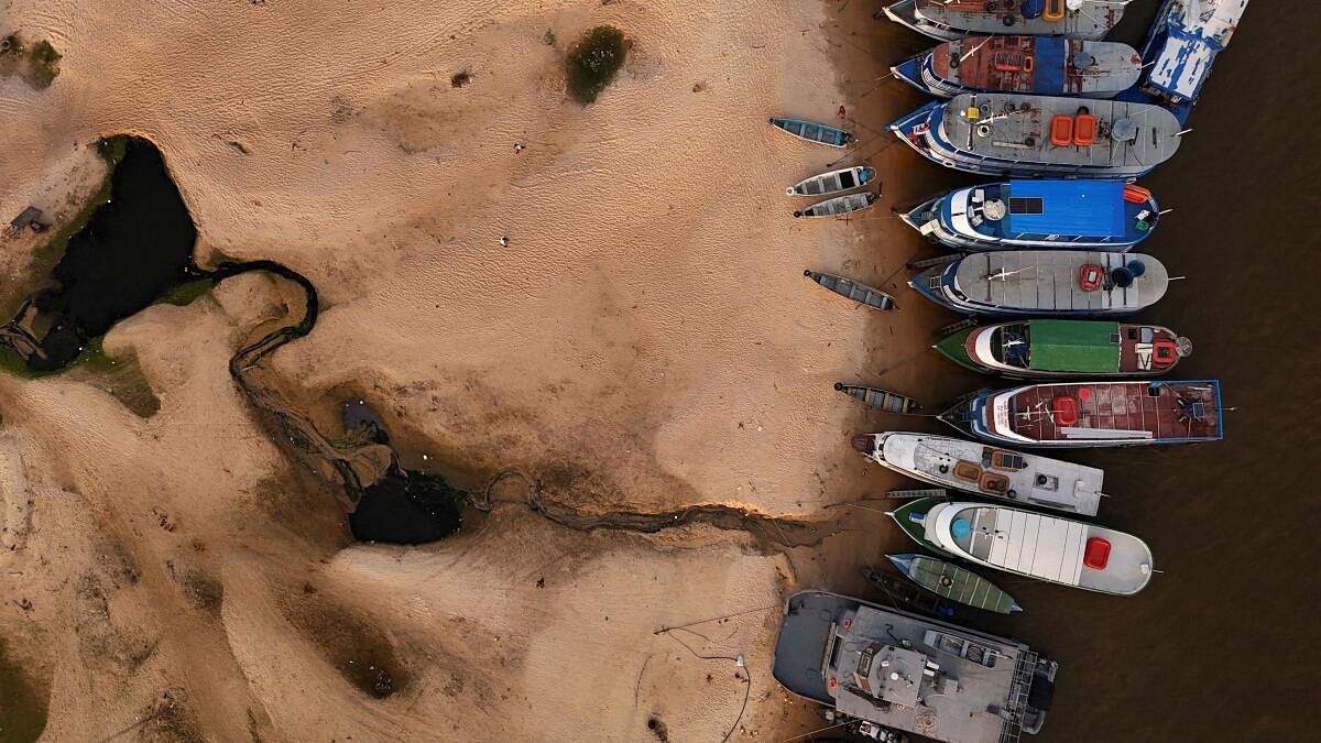 A drone view shows moored boats at the dry banks of Rio Amazonas during a drought in Santarem, Para state, Brazil.