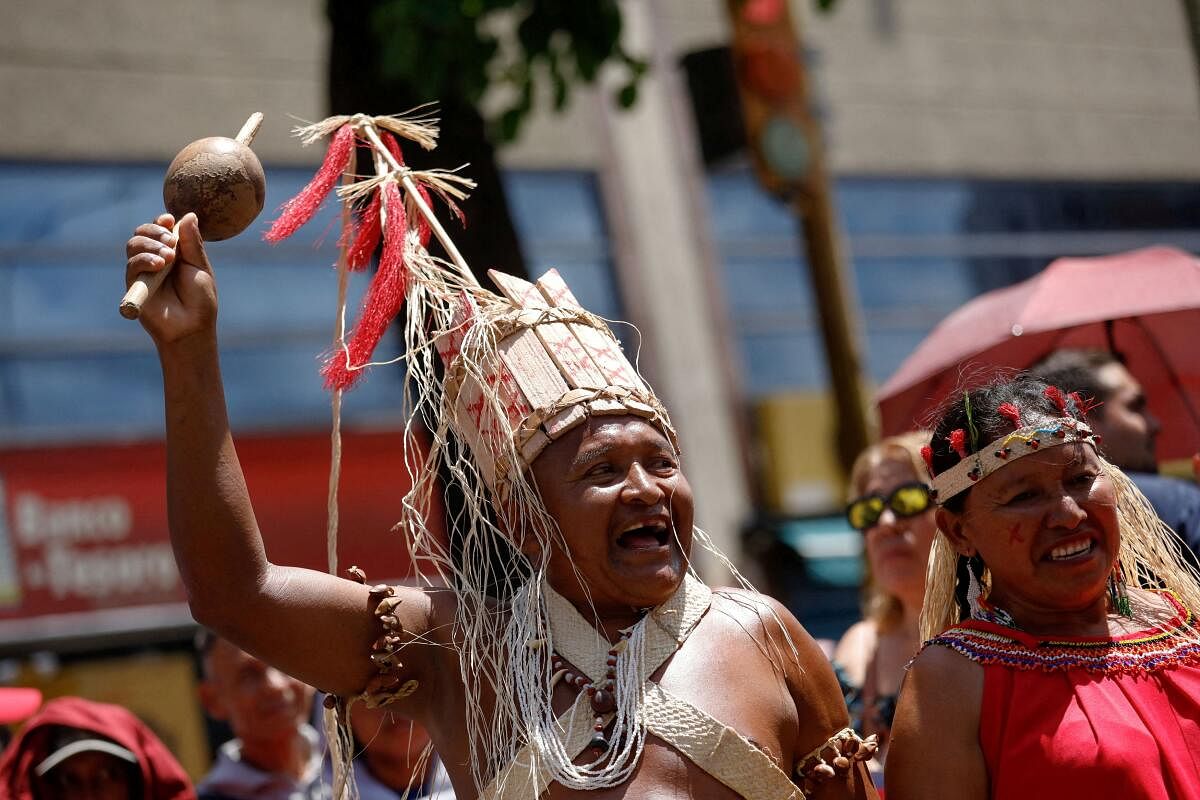 Representatives of the Indigenous Peoples Movement attend an event to mark Indigenous Resistance Day, in Caracas, Venezuela.