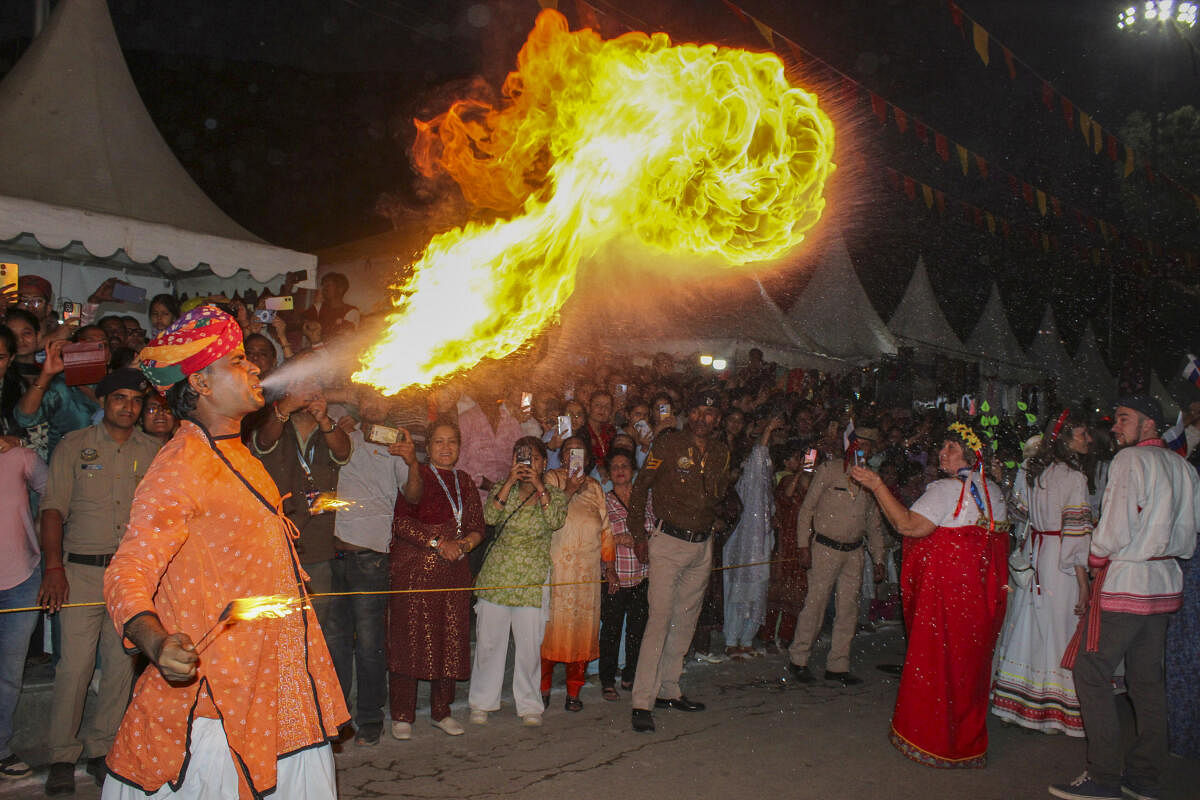 An artist performs at a cultural parade during the week-long International Kullu Dussehra festival, in Kullu district, Himachal Pradesh.