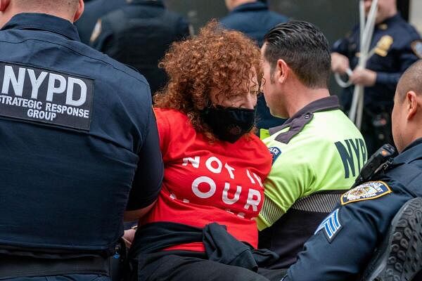 Photographer Nan Goldin is detained during a protest about the ongoing war between Israel and Hamas, outside the New York Stock Exchange (NYSE) in New York City.