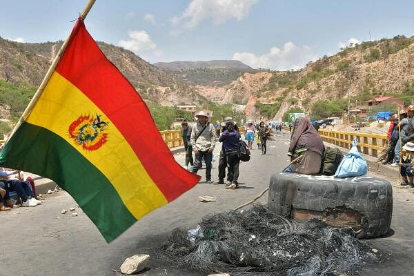 Supporters of Bolivia’s former President Evo Morales gather at roadblocks they set in protest of the government of President Luis Arce, in Parotani, Bolivia.