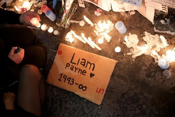 People gather outside the hotel where Liam Payne was found dead, in Buenos Aires.