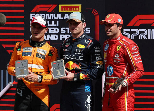  Red Bull's Max Verstappen poses with his trophy after winning the sprint race with second placed Ferrari's Carlos Sainz Jr. and third placed McLaren's Lando Norris.