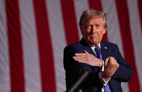 Republican presidential nominee and former U.S. President Donald Trump gestures at the end of his Make America Great Again Rally in Latrobe, Pennsylvani.