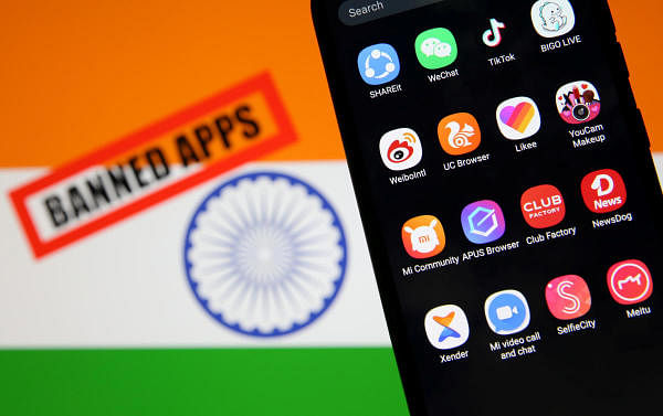 Smartphone with Chinese applications is seen in front of a displayed Indian flag and a "Banned app" sign in this illustration picture