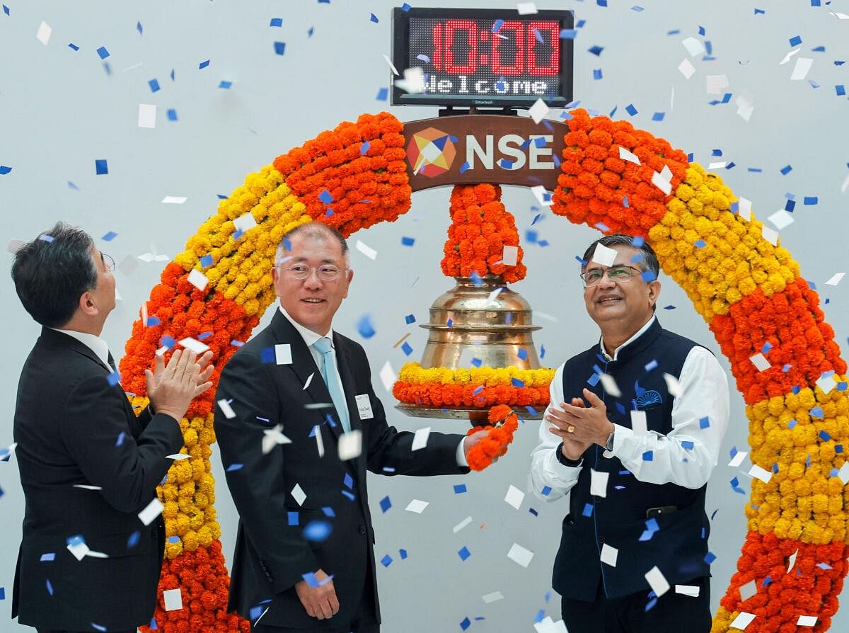 Executive Chairman of Hyundai and Chief Executive Officer (CEO) Hyundai Motor Group, rings the bell as Ashishkumar Chauhan, Managing Director and Chief Executive Officer of the National Stock Exchange (NSE) of India and Jaehoon Chang, Chief Executive Officer (CEO) and President of Hyundai Motor Company, watch on during the listing ceremony of Hyundai Motor India Limited at NSE, in Mumbai, India, October 22, 2024.