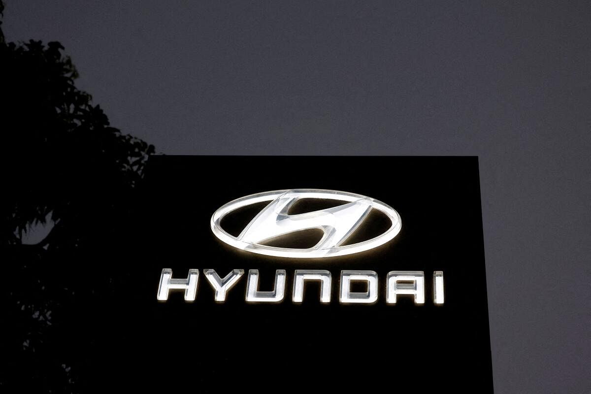 The Logo of Hyundai Motor India Limited is seen outside a car showroom, in Ahmedabad.