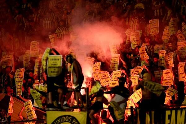 Copa Libertadores - Semi Final - Second Leg - Penarol v Botafogo - Estadio Centenario, Montevideo, Uruguay -  Penarol fans display signs with a message that reads "Free the youth arrested in Brazil" during the match.