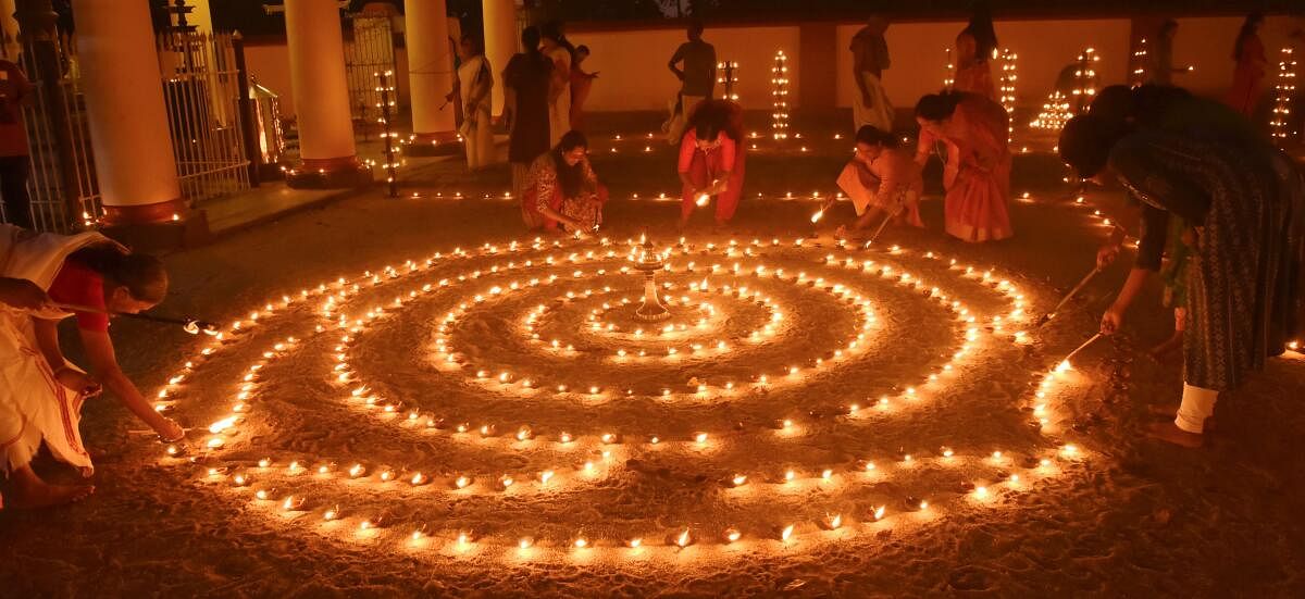 evotees light 'diyas' at the Manjummel Sri Krishna Temple during the Diwali festival, at Ernakulam in Kochi, Kerala, Thursday, Oct 31, 2024.