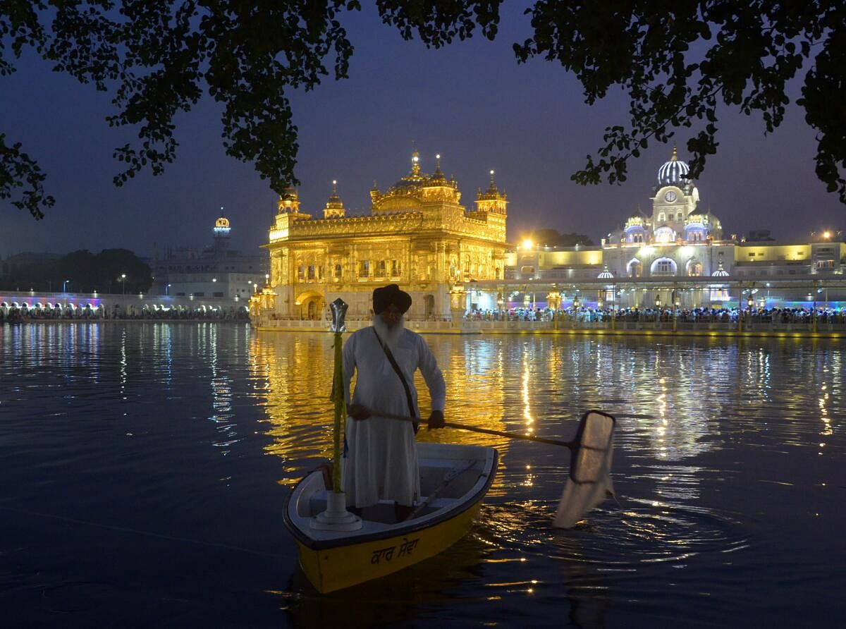 A Sikh devotee at the Golden Temple during the Diwali festival celebration and the eve of the 'Bandi Chhor Divas', in Amritsar, Thursday, Oct 31, 2024.