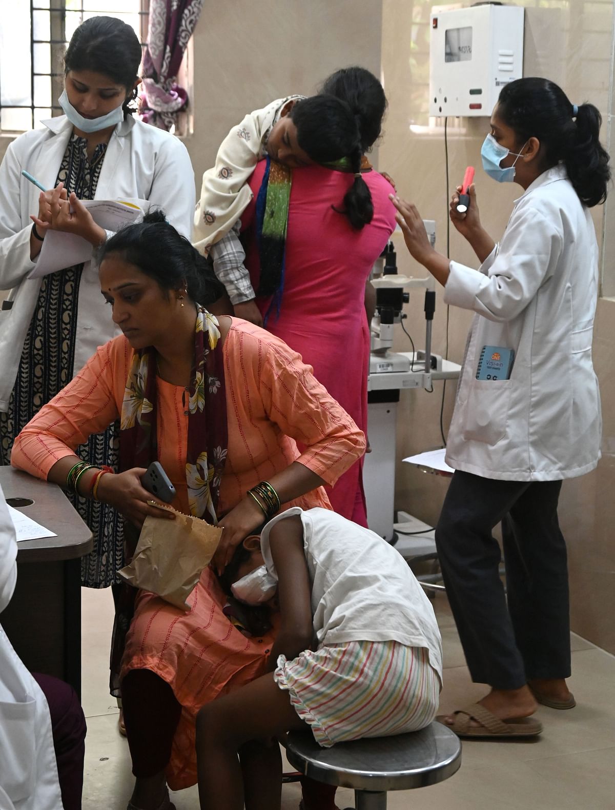 Children receive treatment at Minto Eye Hospital on Friday. 