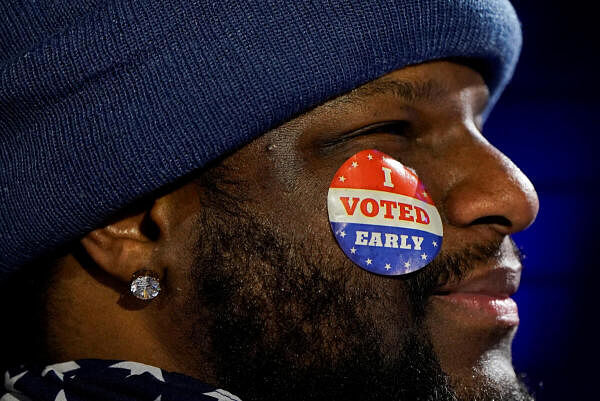 A supporter attends a campaign rally for Democratic presidential nominee US Vice President Kamala Harris at the Wisconsin State Fair Park, in Milwaukee, Wisconsin, US.