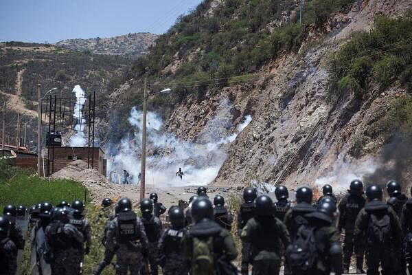 Bolivian police clash with supporters of former President Evo Morales who block key highways impeding delivery of food and fuel, amid rising political tensions between a faction around Morales and the government of his former ally President Luis Arce, in Parotani, Bolivia.