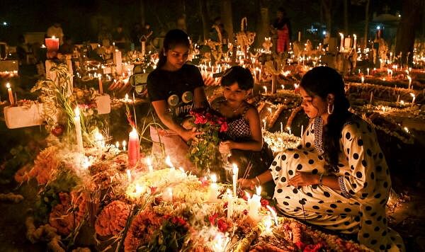 People from the Christian community light candles at a cemetery as they observe ‘All Souls' Day’, in Nadia district, West Bengal.