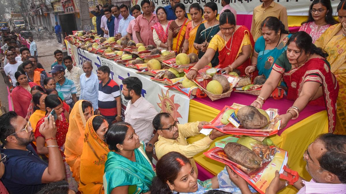 Items being distributed among devotees during the start of the 4-day Chhath Puja festival, in Patna.