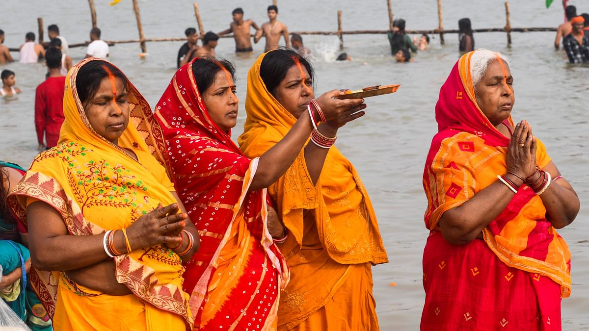 Devotees perform rituals after taking a holy dip in the Ganga river during the start of the 4-day Chhath Puja festival, in Patna.