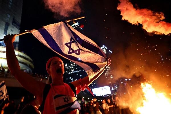 Israelis demonstrate in Tel Aviv after Israeli Prime Minister Benjamin Netanyahu fires Defense Minister Yoav Gallant