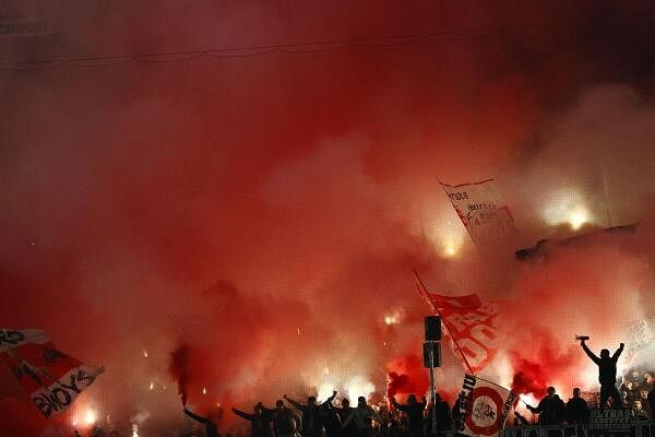 VfB Stuttgart fans with flares inside the stadium before the match