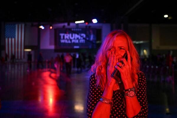 Jennifer Petito gestures after Republican presidential nominee and former US President Donald speech at his rally, at the Palm Beach County Convention Center in West Palm Beach, Florida