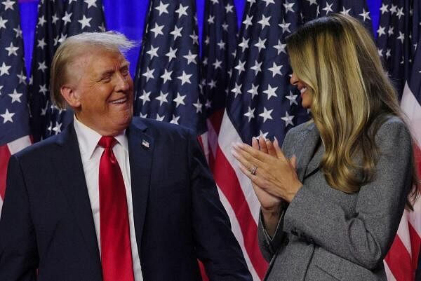 Republican presidential nominee former US President Donald Trump is joined onstage by his wife Melania at his election night rally at the Palm Beach County Convention Center in West Palm Beach