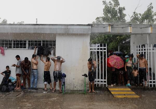 Migrant caravan stops to rest before moving on its way to the U.S.-Mexico border, in Escuintla