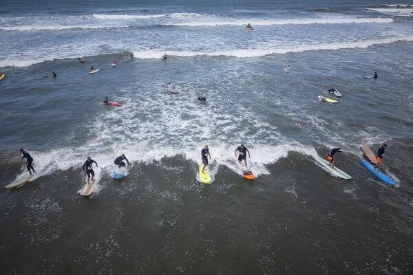 A drone picture of surfers trying to ride the same wave to break the Guinness World Record, in Santos, Brazi.