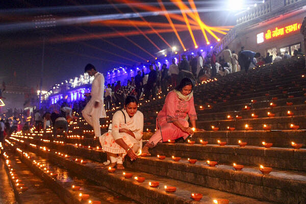 People light earthen lamps on the bank of Ganga river during 'Deepotsav' celebrations on the Uttarakhand Foundation Day, at Har Ki Pauri in Haridwar.