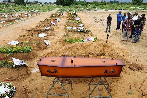 A coffin with the body of Hilario Benjamin Dima, who died during clashes between police and protesters at last week's "national shutdown" against the election outcome, lies at the Michafutene cemetery, during his burial in Maputo, Mozambique.