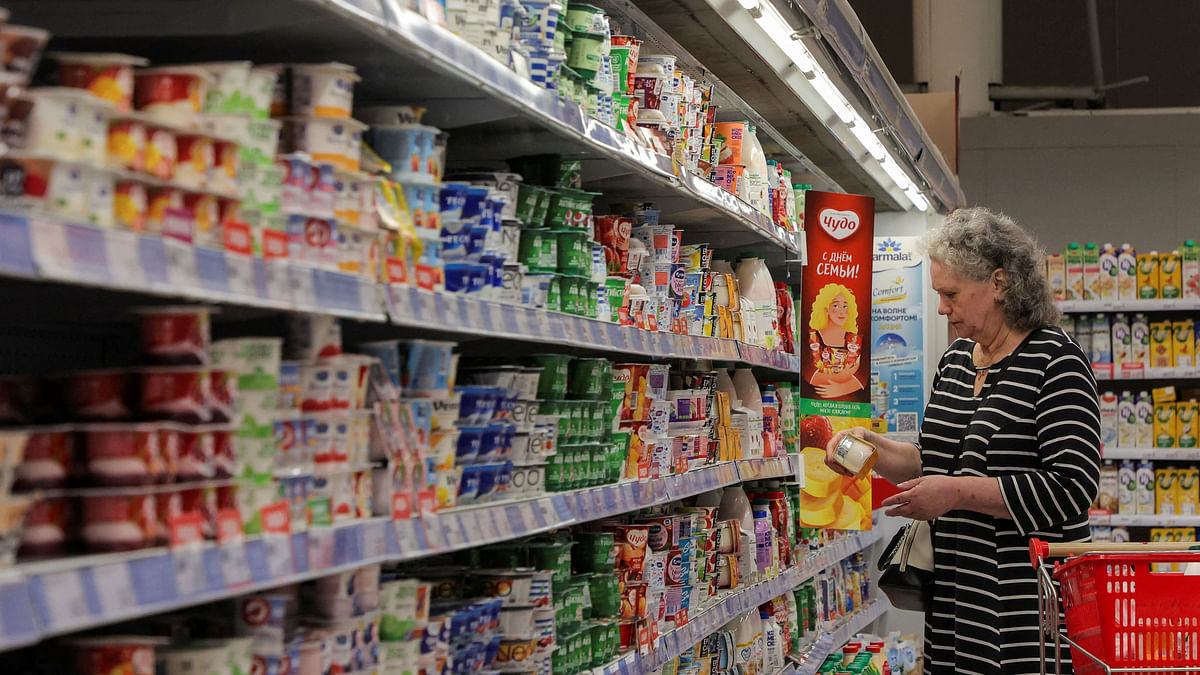 FILE PHOTO: A customer shops for dairy products at a grocery store