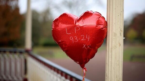 A heart-shaped balloon is placed as a tribute to remember former One Direction singer Liam Payne, who was found dead after he fell from a third-floor hotel room balcony in Buenos Aires, in a park in his hometown of Wolverhampton, Britain.