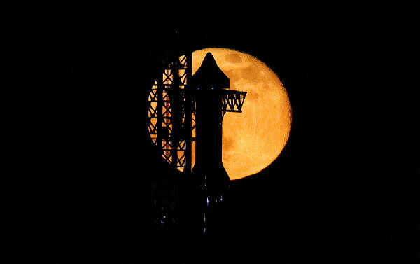 SpaceX's next-generation Starship spacecraft atop its powerful Super Heavy rocket is prepared for launch as the moon rises over the company's Boca Chica launchpad, in Brownsville, Texas, U.S., November 16, 2024.