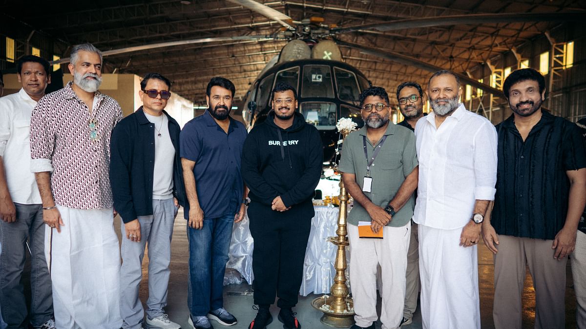 Mohanlal poses with the crew.