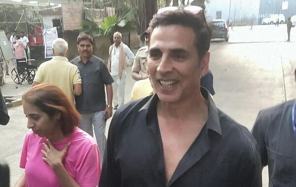  Actor Akshay Kumar interacts with the media after casting vote at a polling station during the Maharashtra Assembly elections, in Mumbai.