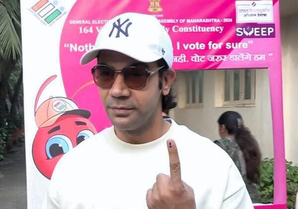  Actor Rajkummar Rao shows his finger marked with indelible ink after casting vote during the Maharashtra Assembly elections, in Mumbai.