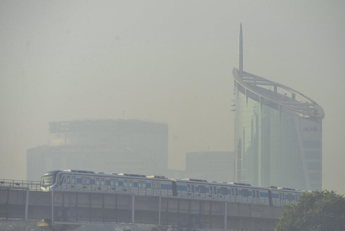 A Rapid metro train runs amid low visibility due to smog, in Gurugram, Wednesday, Nov. 20, 2024.