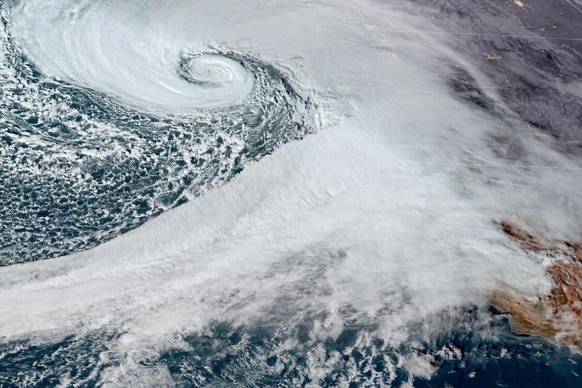 A low pressure storm system known as a "bomb cyclone" forms off the coast of the U.S. Pacific Northwest and western Canada in a composite satellite image November 19, 2024.