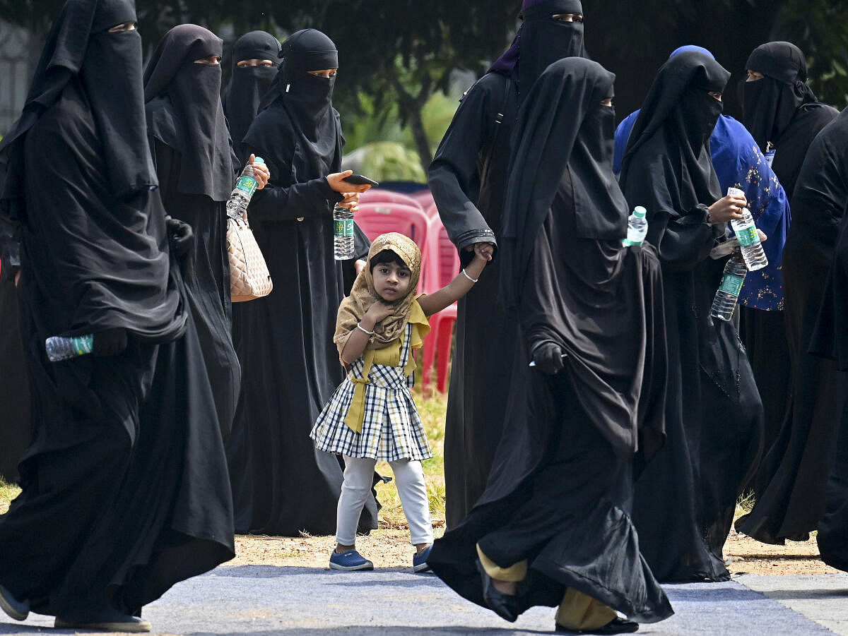 Muslim women arrive to attend a meeting organised by All India Muslim Personal Law Board regarding the ongoing Waqf issue, in Bengaluru, Karnataka, Wednesday, Nov. 20, 2024.