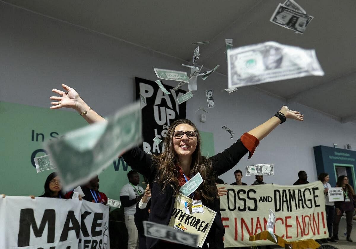 Environmental activists perform during a protest at the COP29 United Nations climate change conference, in Baku, Azerbaijan November 21, 2024.