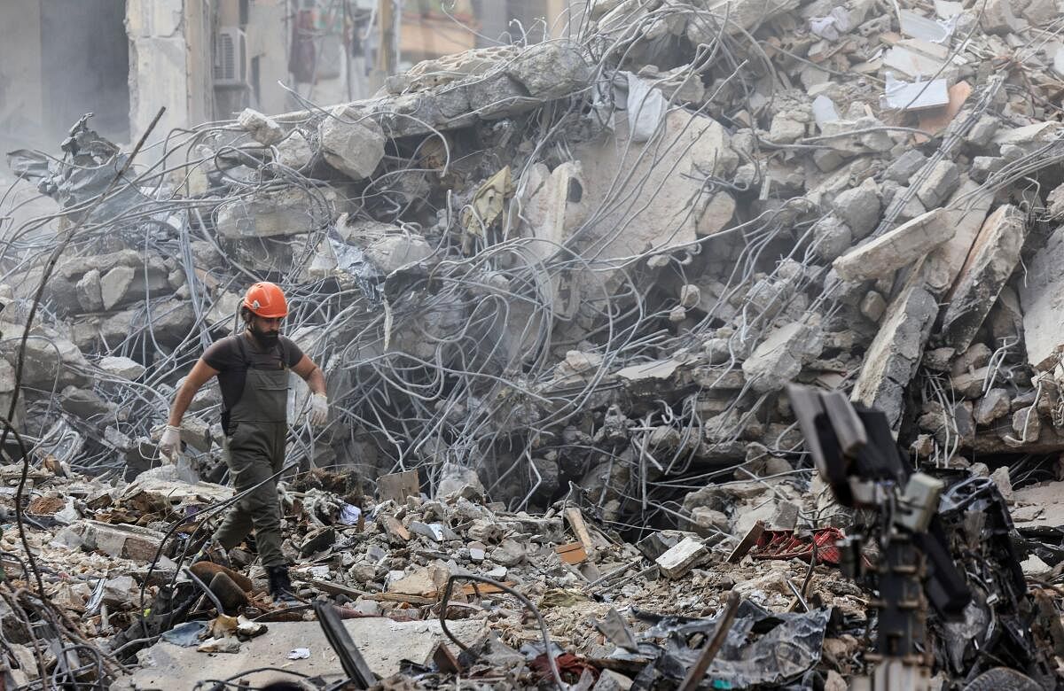 A civil defense member walks among the debris at the site of an Israeli strike in Beirut's Basta neighbourhood, amid the ongoing hostilities between Hezbollah and Israeli forces, Lebanon November 23, 2024.