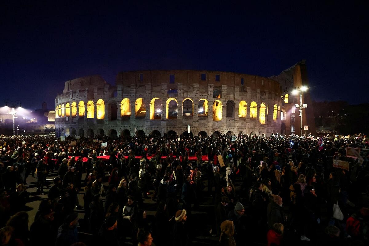 People from Non Una di Meno (Not One Less) movement and feminist collectives walk past the Colosseum as they take part in a protest ahead of the International Day for the Elimination of Violence against Women, in Rome, Italy, November 23, 2024.