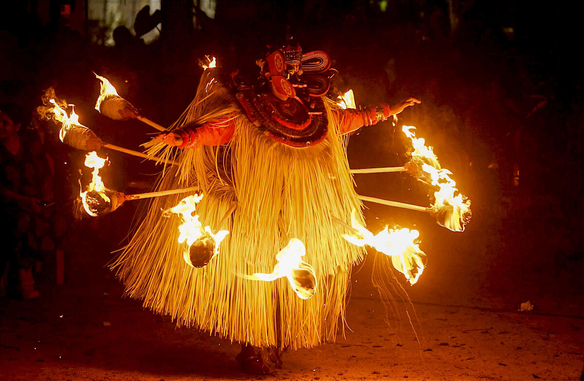 Artists perform Kandakarnan Thirra, a traditional ritual art form at the Krishna Menon Museum, in Kozhikode.