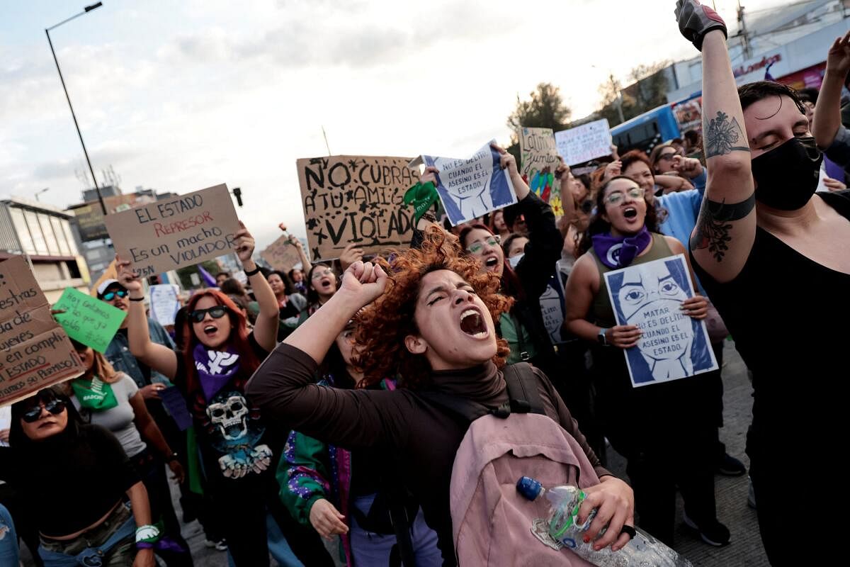 Demonstrators participate in a protest to mark the International Day for the Elimination of Violence Against Women, in Quito, Ecuador.