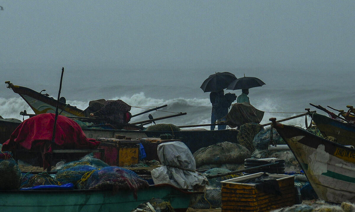 Fishing boats anchored amidst the forecast of heavy rains at Marina beach, along the coast of the Bay of Bengal, in Chennai.