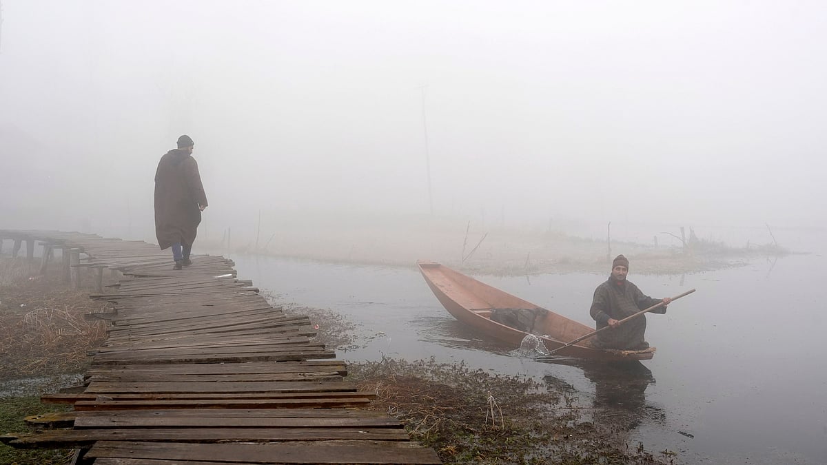 Kashmir shrouded in dense fog, freezing temperatures.