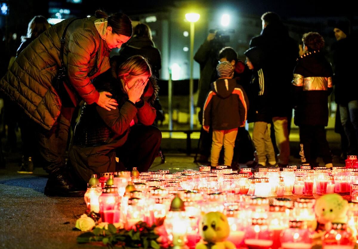 A woman reacts following a knife attack in a primary school, in Zagreb, Croatia.