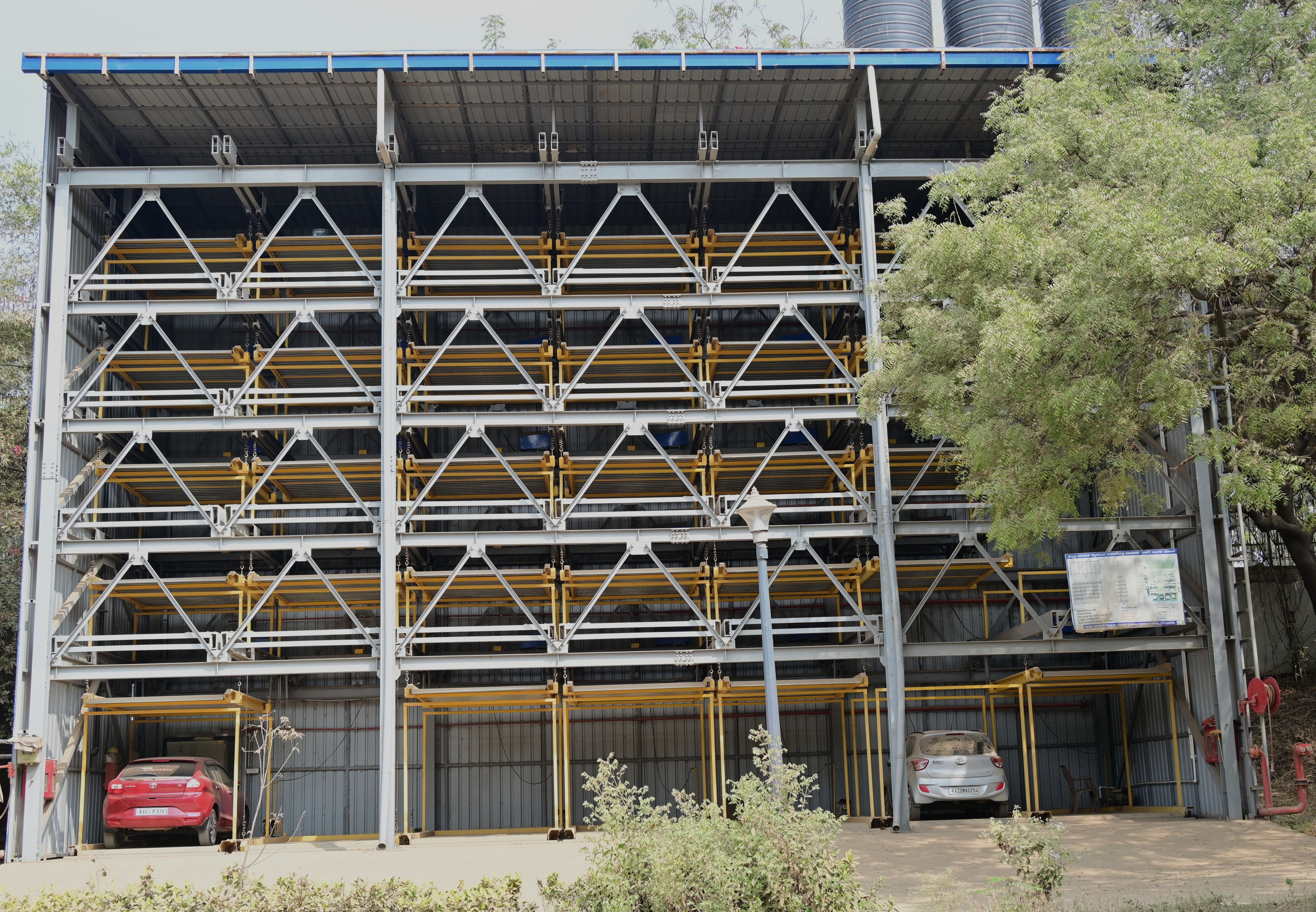 The Tunga riverfront project implemented under the Smart City Mission is deserted today due to issues with its management; (Right) The puzzle parking system in Hubballi constructed under the SCM has no takers. 