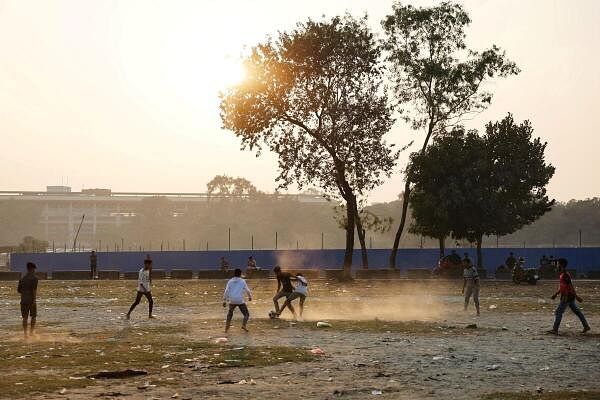 Boys play football at the Suhrawardy Udyan in the afternoon, in Dhaka, Bangladesh, January 19, 2025.