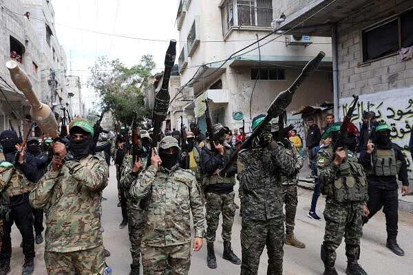 Hamas militants carry grenade launchers at the funeral of Marwan Issa, the deputy Hamas commander, who was killed in an Israeli airstrike during the conflict between Israel and Hamas.