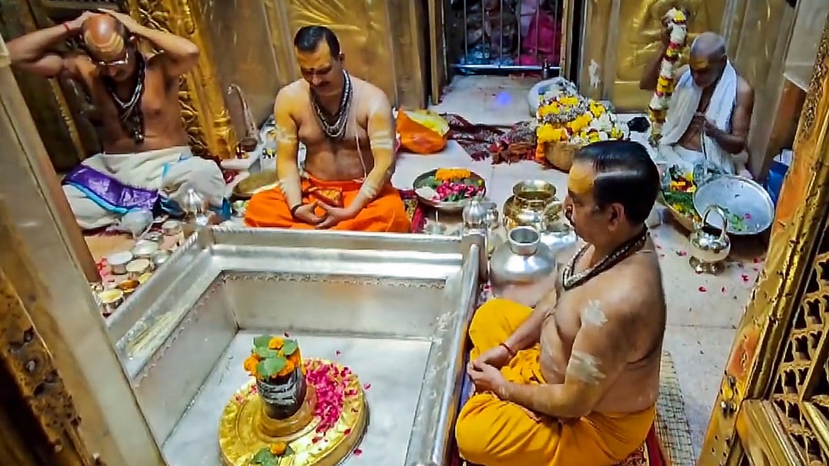 Priests prepare for Mangala Arti of Baba Vishwanath at Kashi Vishwanath temple on the occasion of Maha Shivratri in Varanasi.