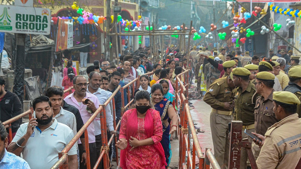 Devotees wait in queues to offer prayers to Lord Shiva at Anandeshwar Dham on the occasion of Maha Shivratri in Kanpur.